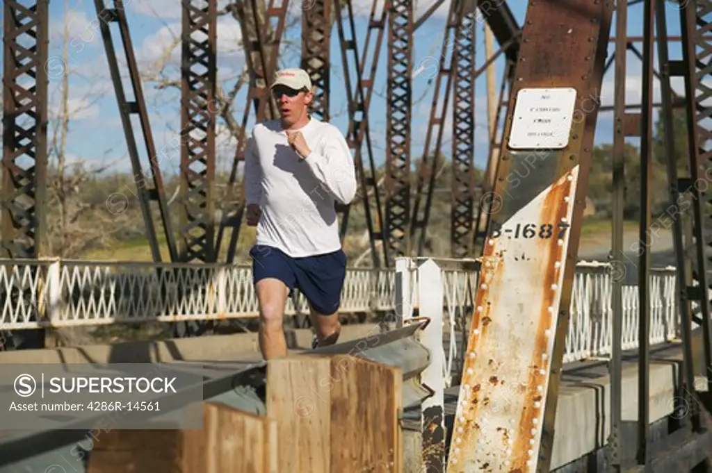 A man running across an old bridge in Verdi Nevada