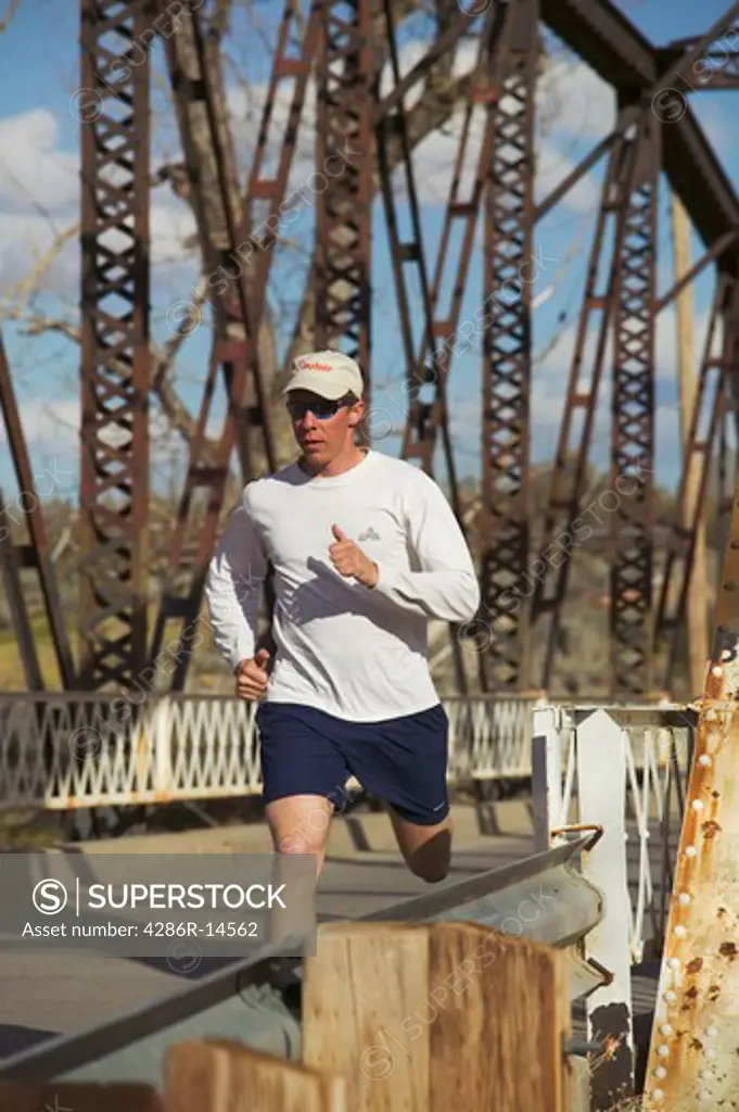 A man running across an old bridge in Verdi Nevada