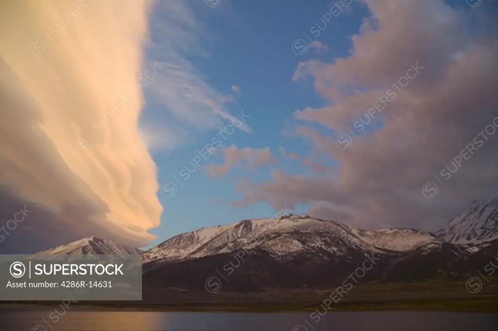 A lenticular cloud at sunset over Crowley Lake, CA and the Sierra mountains.