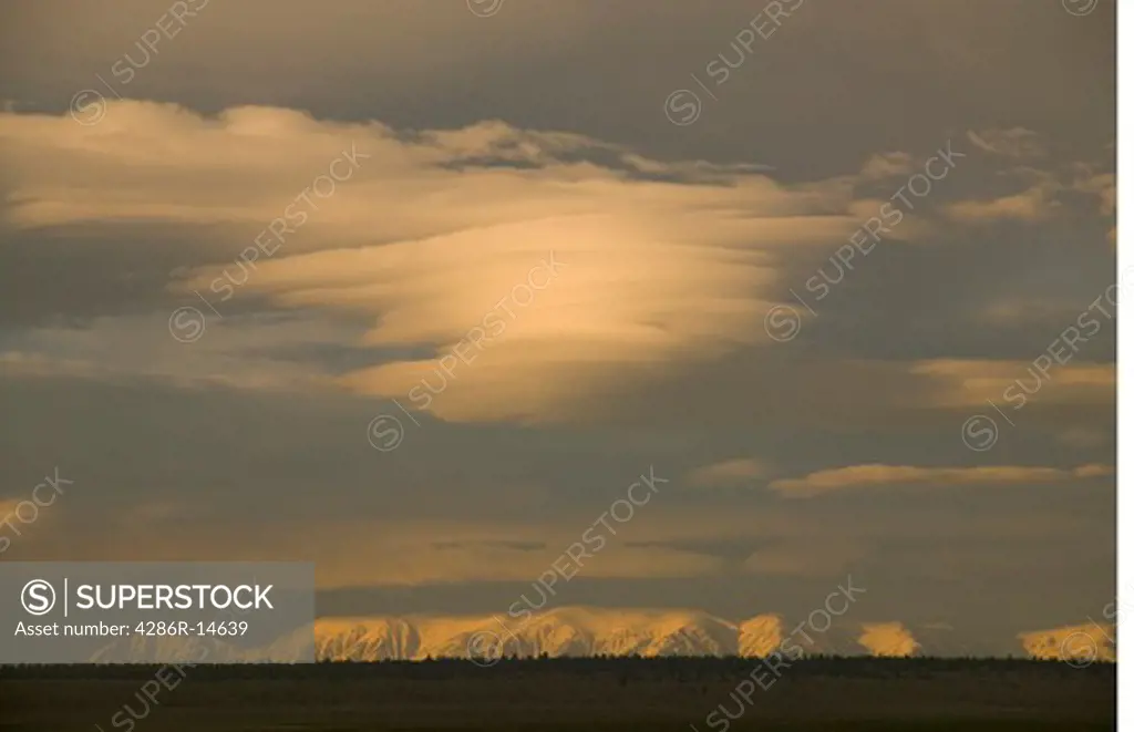 A lenticular cloud at sunset over the White mountains.