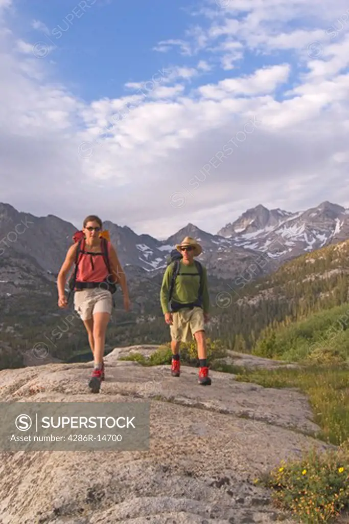 A couple hiking in Rock Creek Canyon in the Sierra mountains of California.
