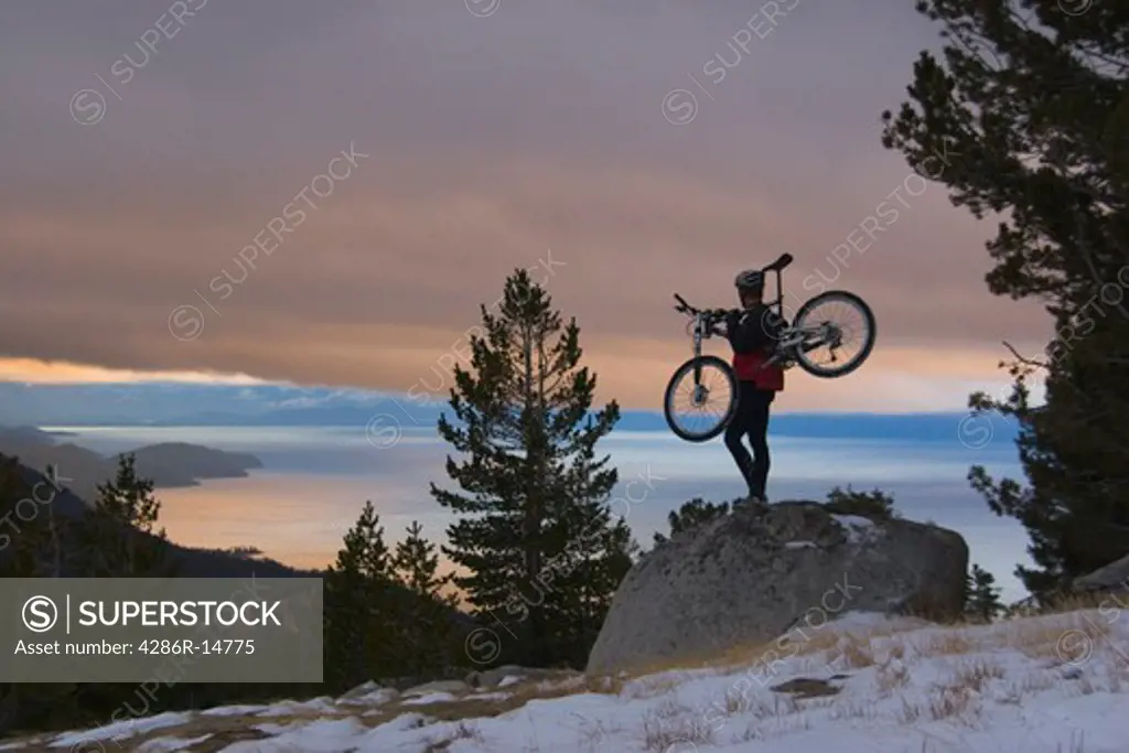 A Man Mountain Biking in Winter Above Lake Tahoe.