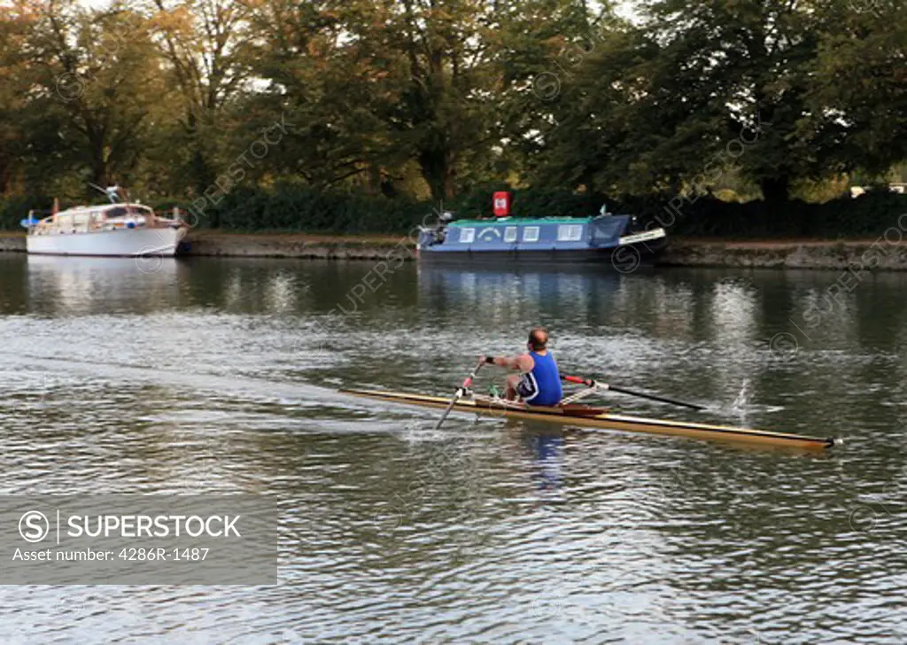 An oarsman powers his skiff down the Cherwell in Oxford.