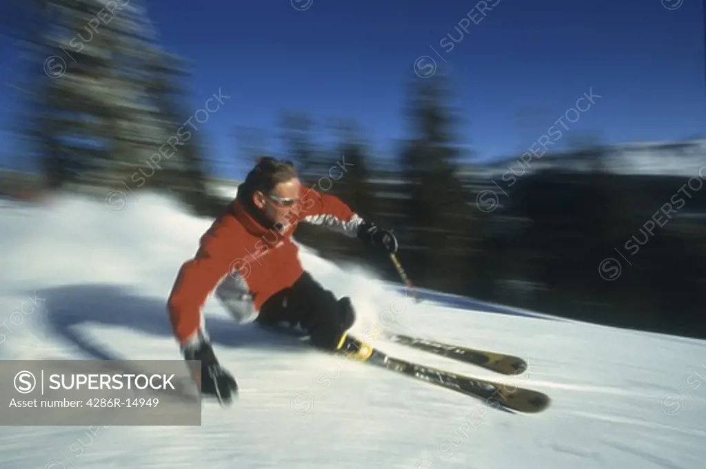 A man skiing fast a Diamond Peak near Lake Tahoe in California.