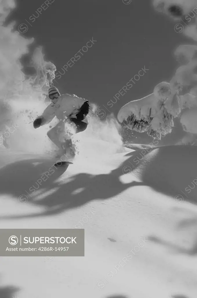 A black and white photo of a snowboarder in powder snow at Diamond Peak in Nevada.