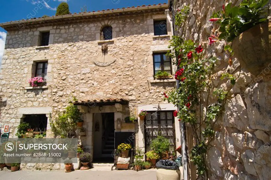 Medieval buildings and flowers in the town of Gourdon in Provence France