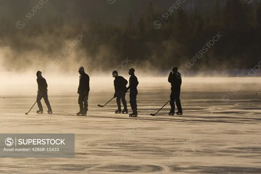 A group of ice skaters on frozen Donner Lake near Truckee California