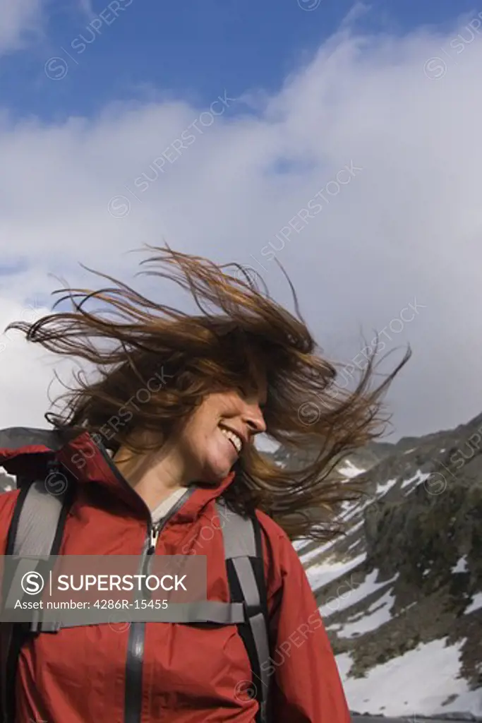 A woman tossing her hair while hiking near Chamonix France