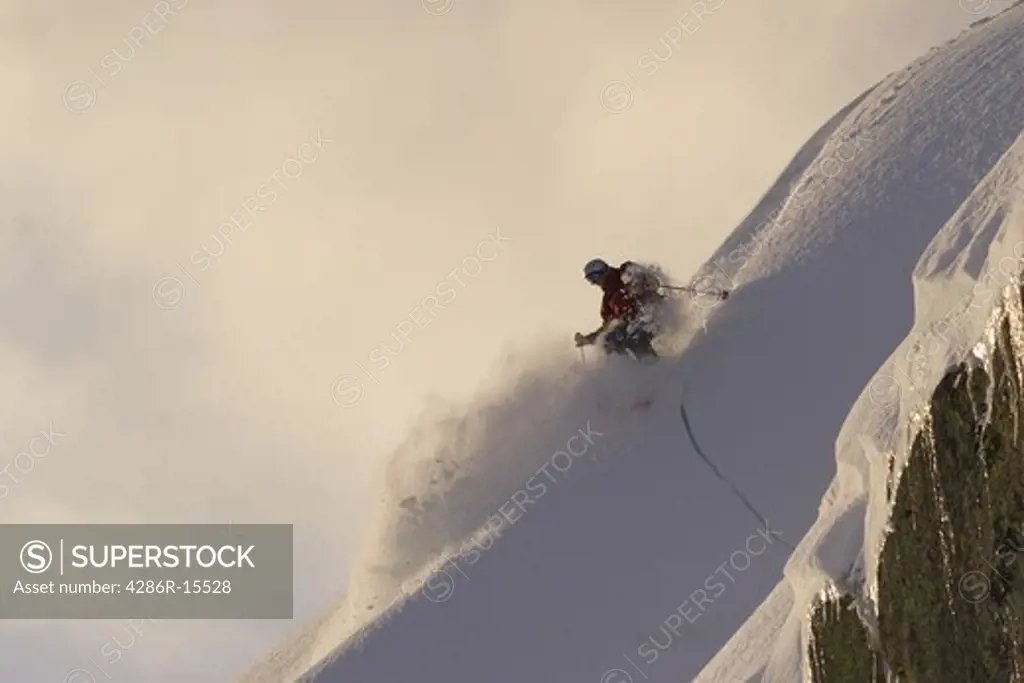 A woman skiing powder snow in the early morning on Donner Summit near Lake Tahoe in California