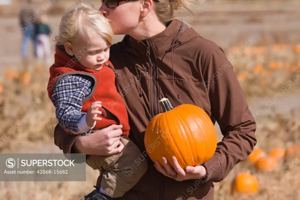 A mother and son walking in a pumpkin patch in Fallon Nevada
