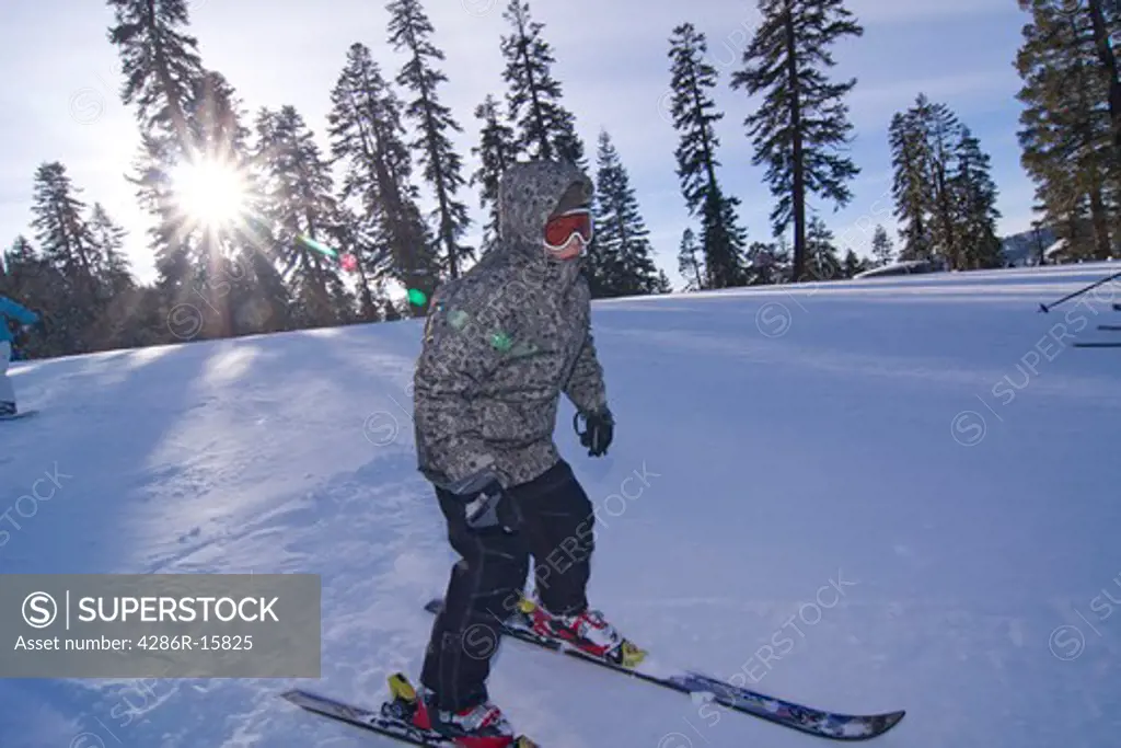 A boy skiing at Sierra at Tahoe ski resort near Lake Tahoe in California