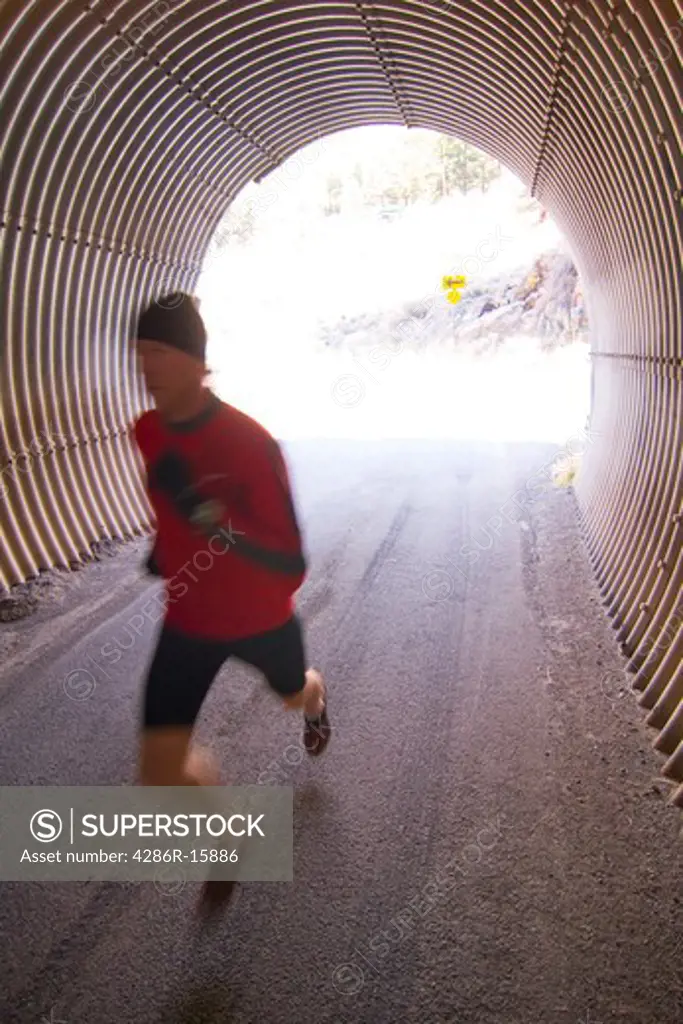 A man running through a tunnel in Reno in Nevada