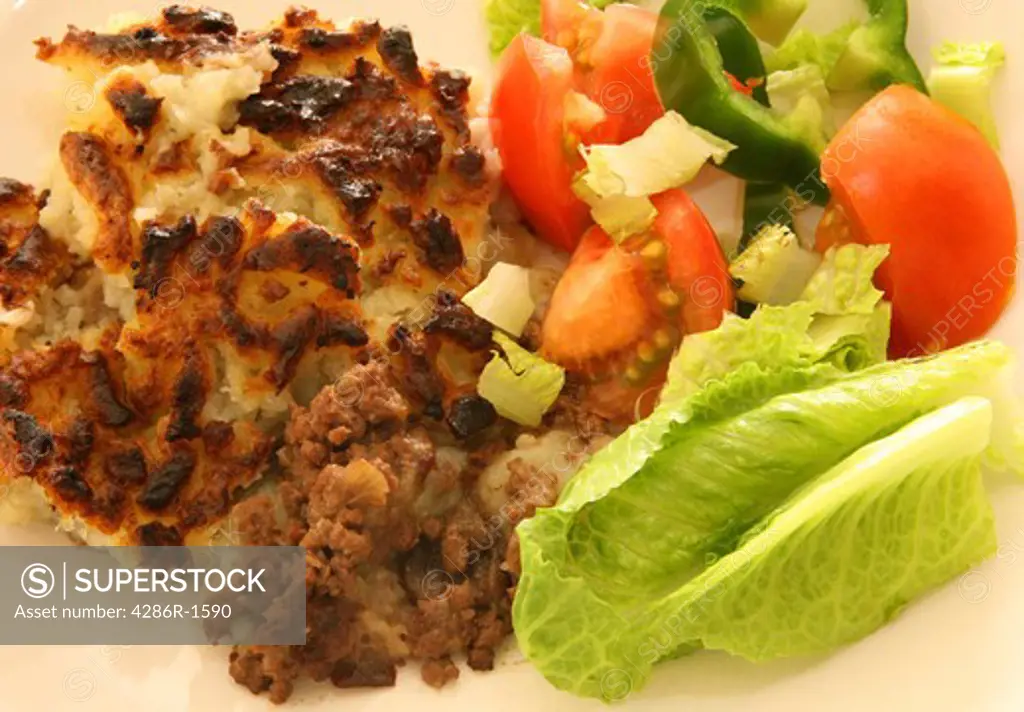 Shepherd's pie and salad, traditional British home-cooking.