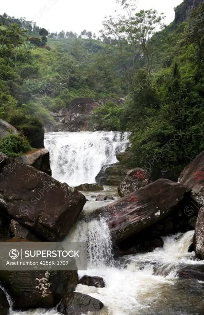 A view of Ramboda falls, Sri Lanka, in the tea plantation country (a tea estate is visible in the background).
