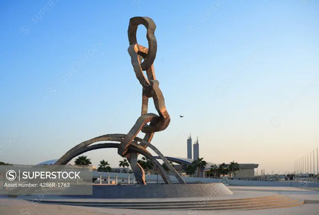 The Olympic Rings-based sculpture erected for the 2006 Asian Games in Doha, Qatar, at the Aspire Sports complex. The site's mosque is in the background.
