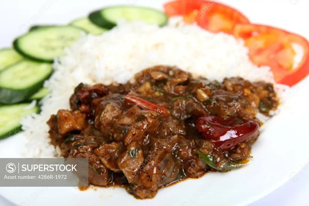 Chinese beef szechuan (or szechwan, or Sichuan) with white rice and a salad of cucumber and tomato