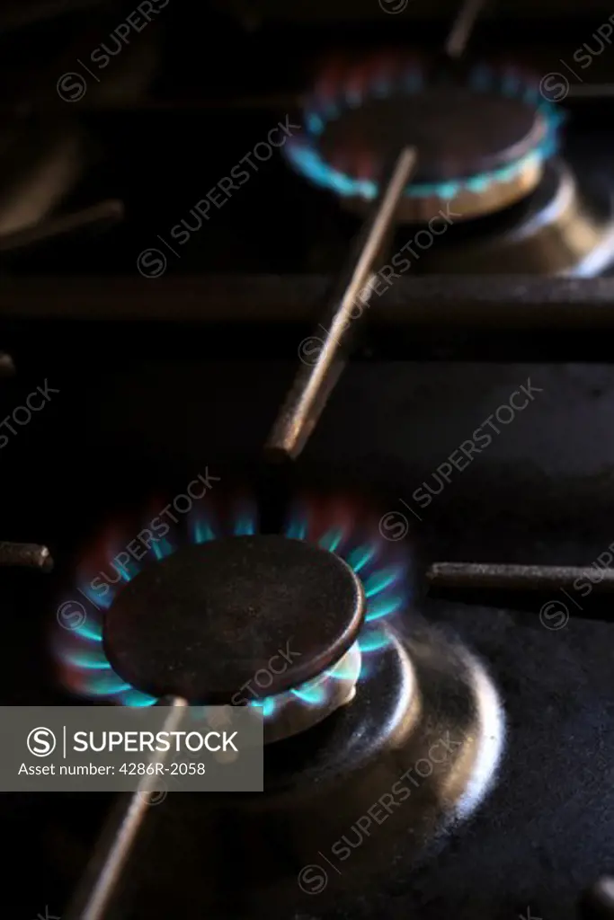 Lit gas burners on a domestic cooker