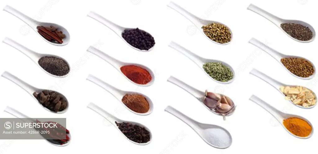 Spices commonly used in asian and other dishes. Each spoon was shot separately as a 60MB file which are for sale here separately if anybody needs the full size inages rather than the composite. From left to right, top row: cassia bark (or cinnamon); black pepper corns; coriander seeds, cumin seeds, Second row: ground black pepper; red chilli powder; fennel seeds; fenugreek seeds Third row: black cardamon pods; cinnamon powder; garlic cloves; dried garlic slices Fourth row: dried chillies, cloves