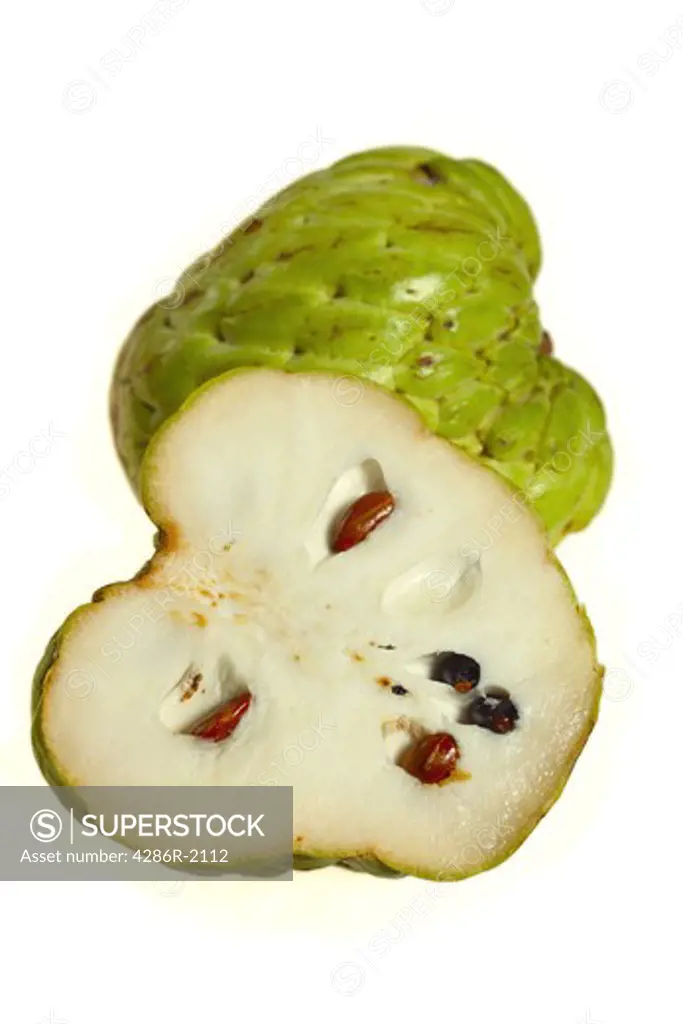 A custard apple, Annona squamosa, also known as a sugar apple, cut in half, showing both the outside and the inside