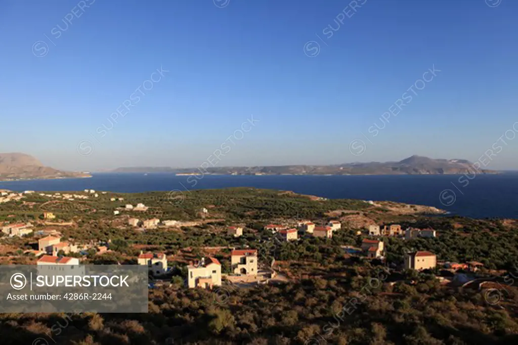 The view across Souda Bay to Akrotiri on Crete shortly after sunrise. The new houses are almost all owned by foreign sunseekers from northern Europe, most of them from Britain.