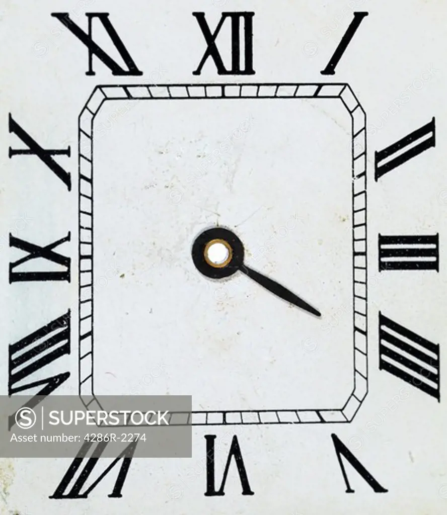 The dial of a watch with the hour hand still attached