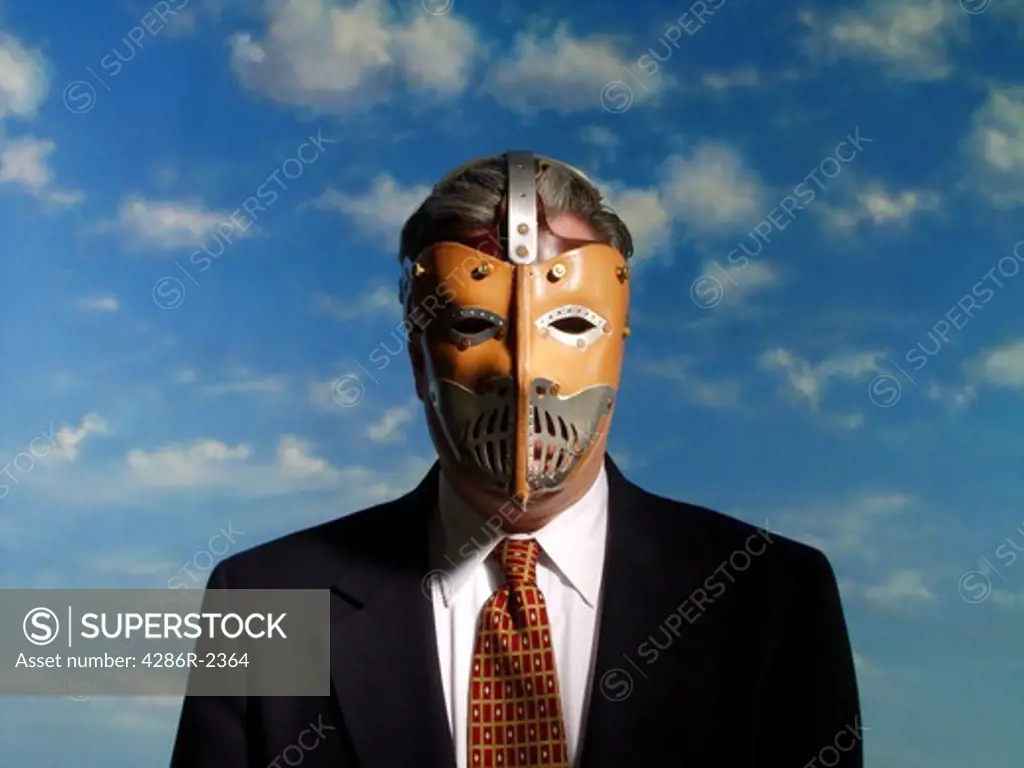Businessman with scary mask