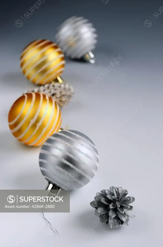 Christmas arrangement with glass bauble ornaments and pine cones