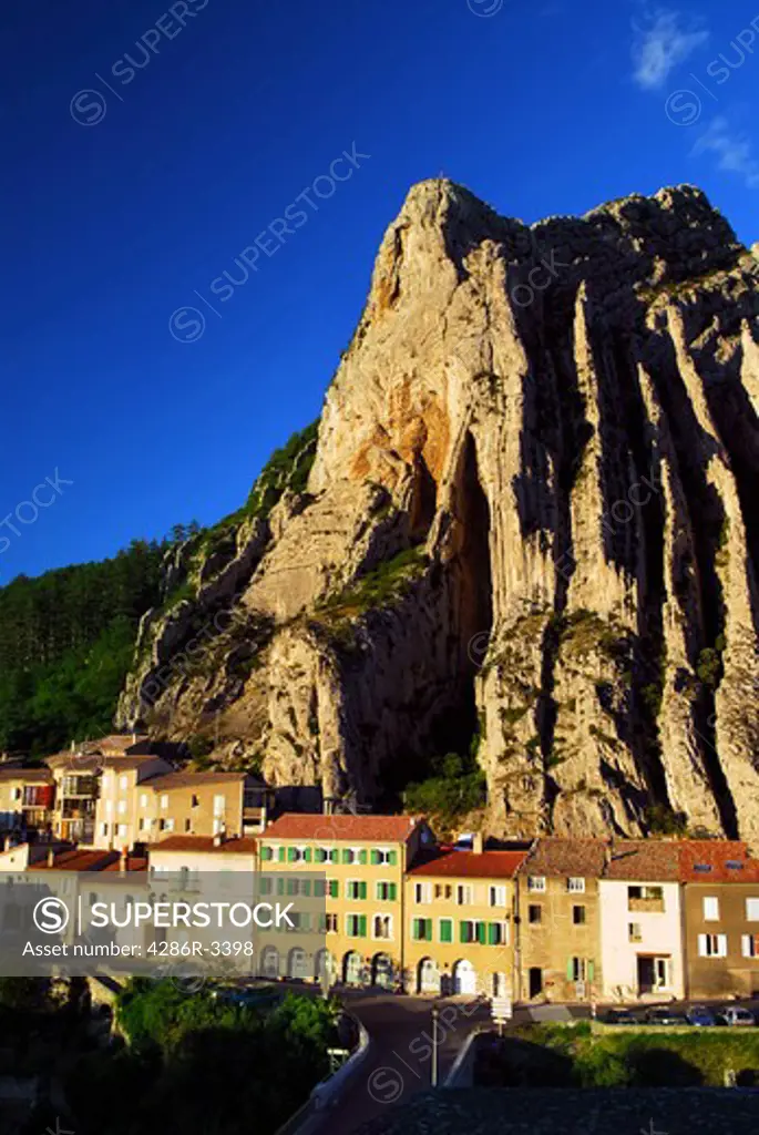 Houses at the base of a cliff in town of Sisteron in Provence, France