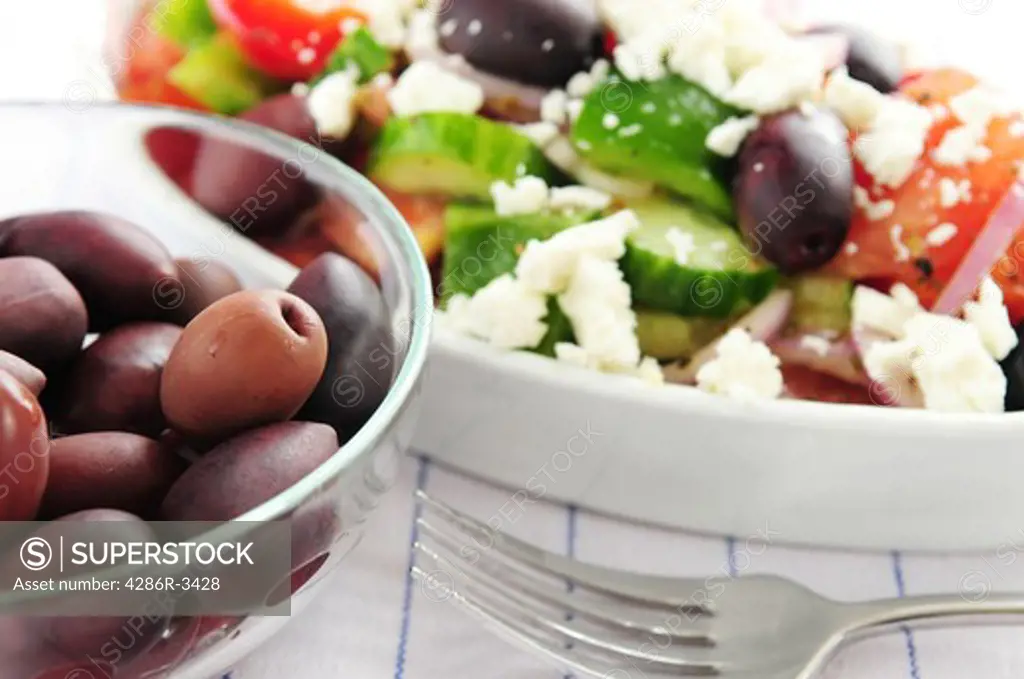 Black kalamata olives and greek salad with feta cheese