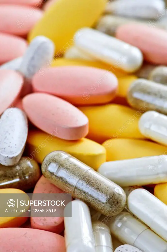 Mix of vitamins and herbal supplements close up