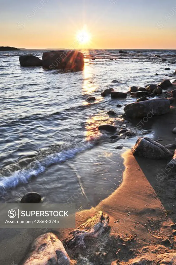 Sunset at the rocky shore of Georgian Bay, Canada. Awenda provincial park.