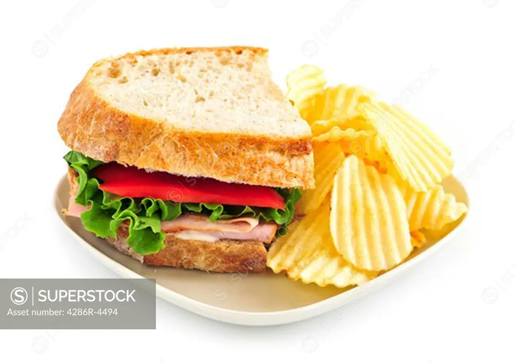 Sandwich with potato chips isolated on white background