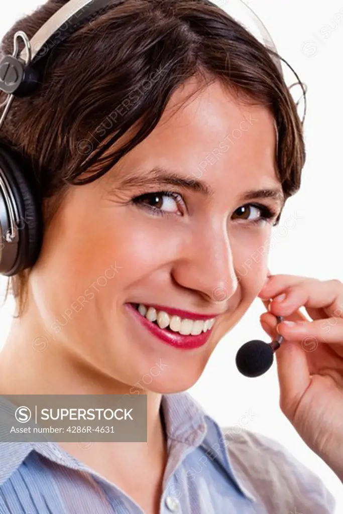business - young brunette woman with headset on her head