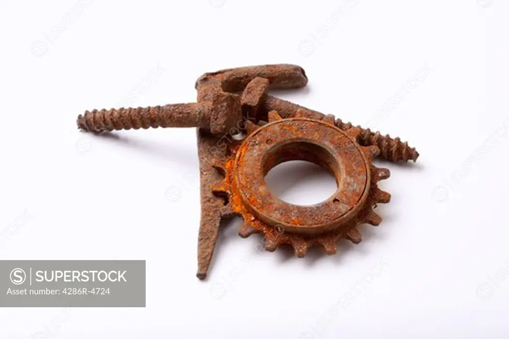 rusty old bolts and cogwheel isolated on white background - clipping path