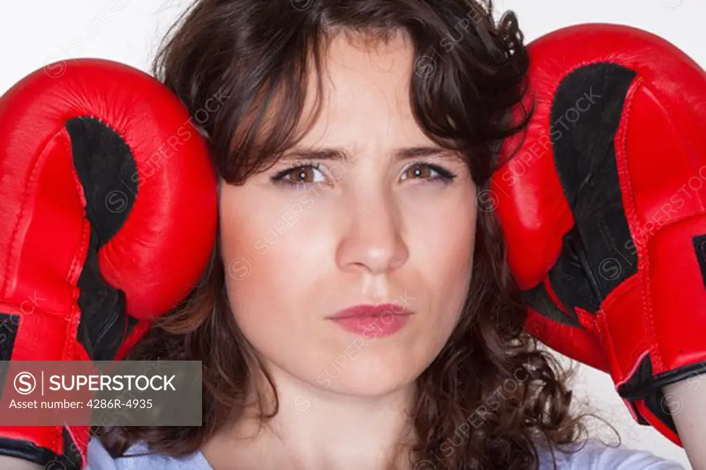 sport - young woman with red boxing gloves