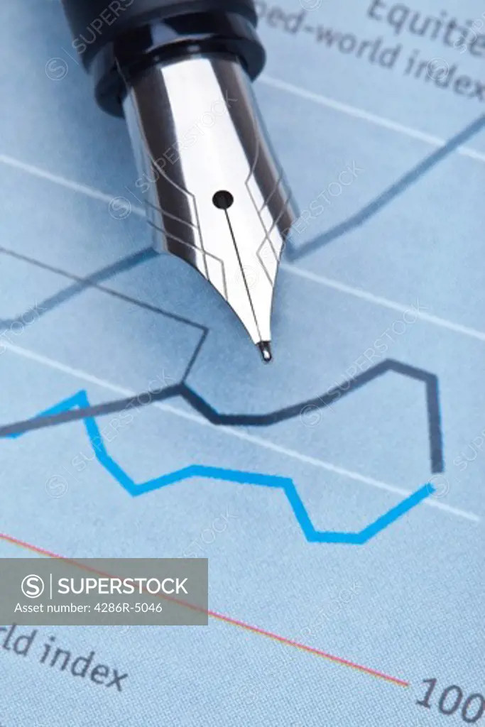 extreme closeup of a fountain pen and charts