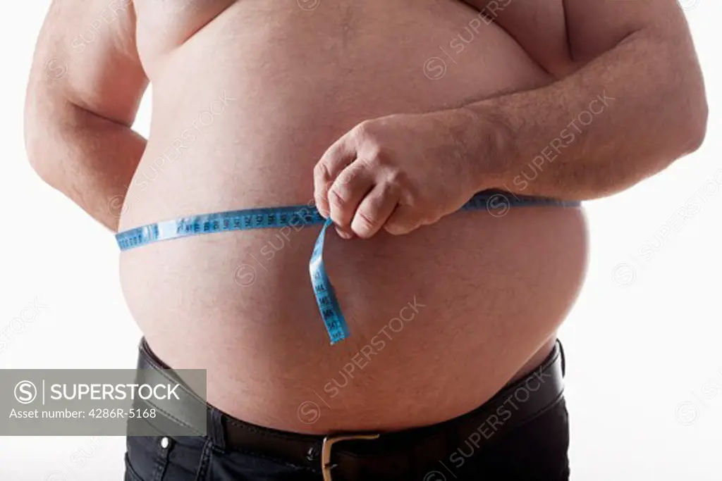 big belly of a fat man and measuring tape isolated on white