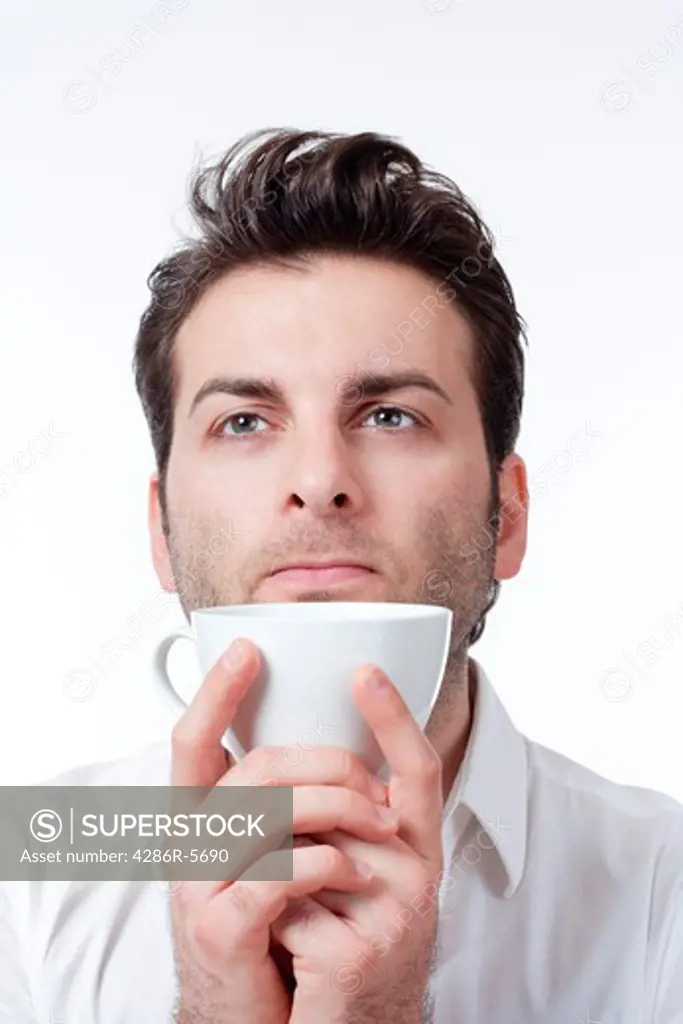 man in shirt holding cup of coffee looking up - isolated on white