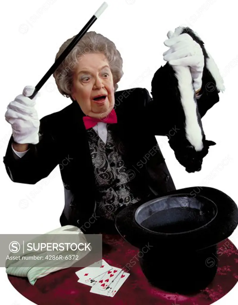 Portrait of an older woman dressed as a magician pulling a stunk out of a hat