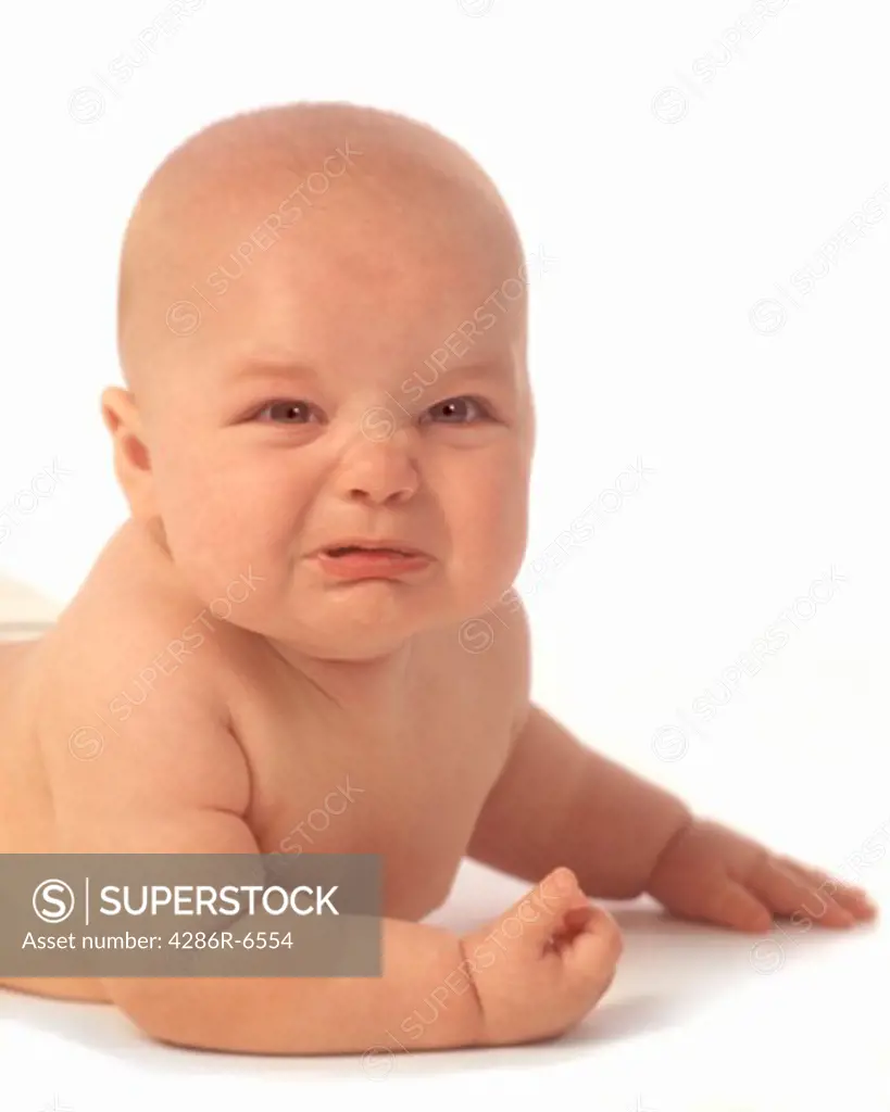Medium close up of a crying baby.