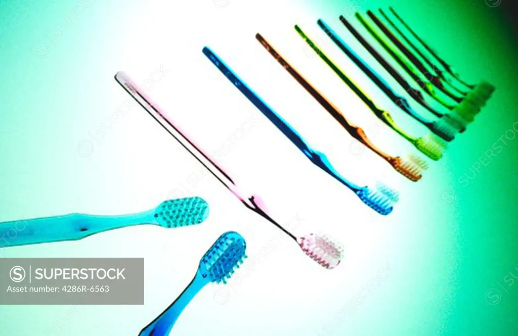 Seamless still life of colorful toothbrushes in a line.