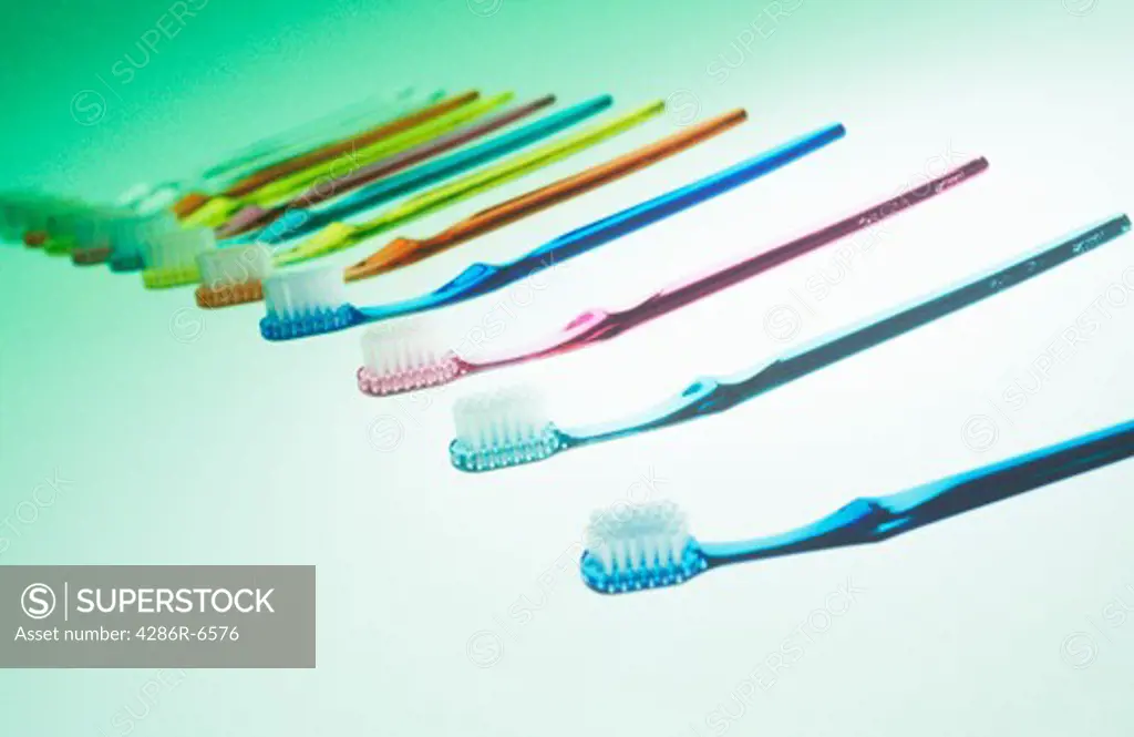 Seamless still life of colorful toothbrushes in a line.