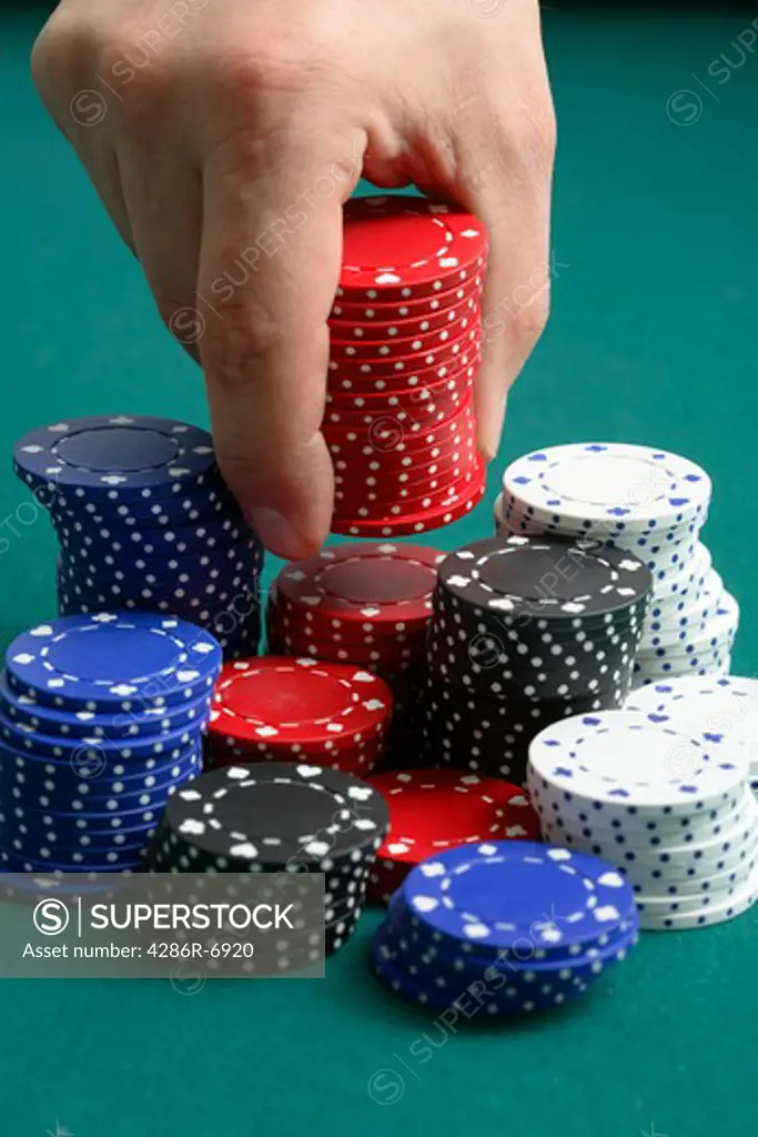 Picking up stack of poker chips