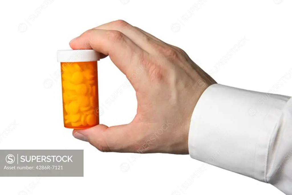 Hand holding pill bottle