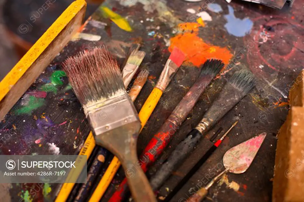 Still life detail of paintbrushes in art studio