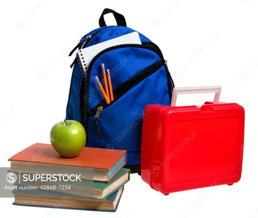 School books, lunch pail and backpack with school supplies