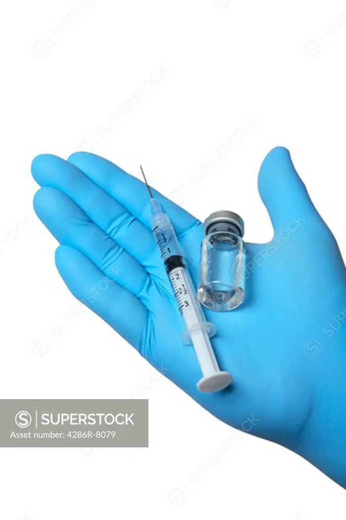 Syringe and medication in hand