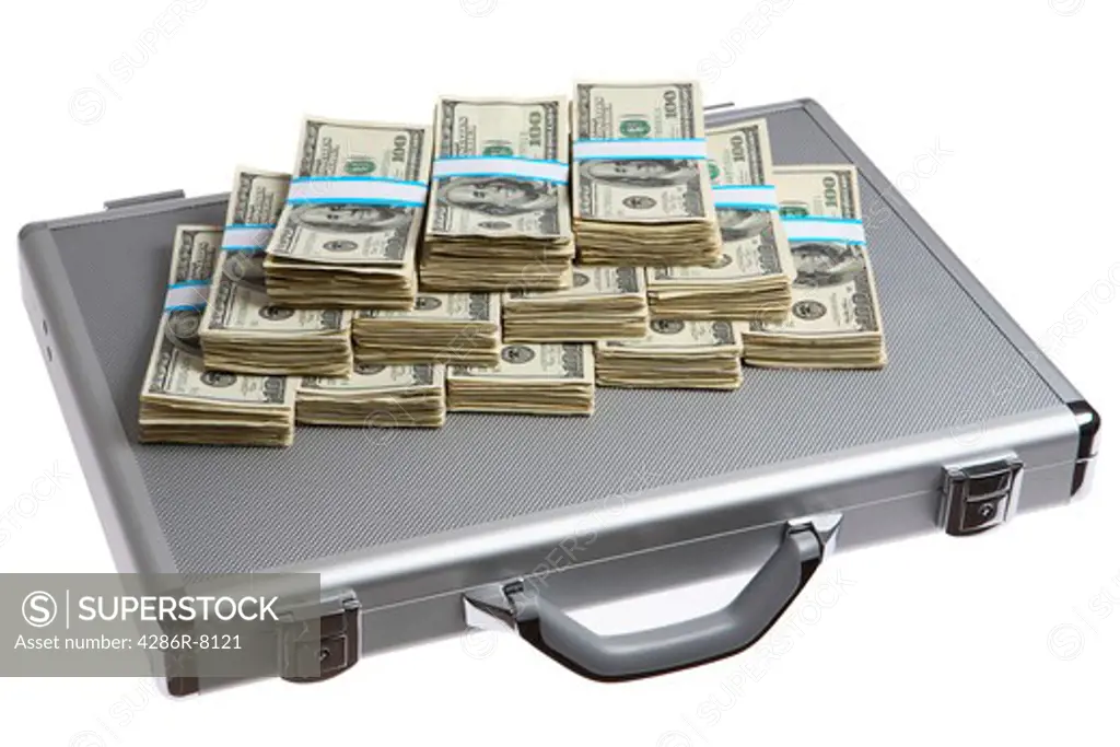 Briefcase with stacks of one hundred dollar bills on top