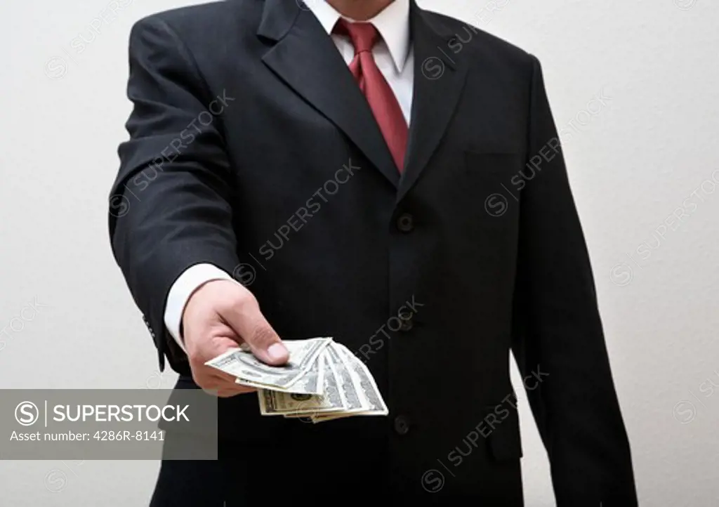Businessman giving cash