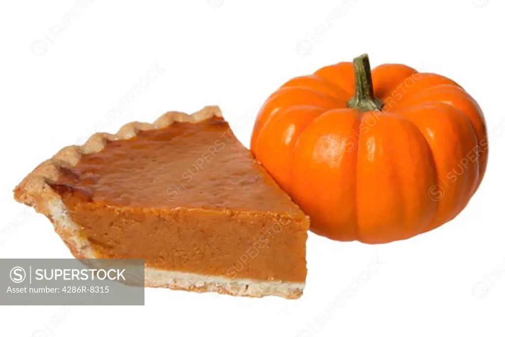 Slice of pumpkin pie and pumpkin